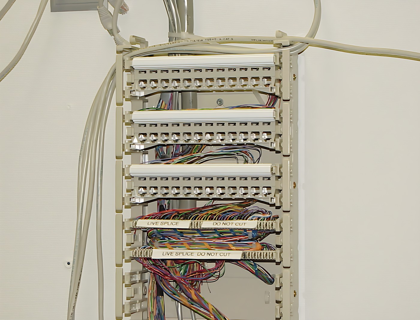 Electrical panel with multiple rows of cables and wires